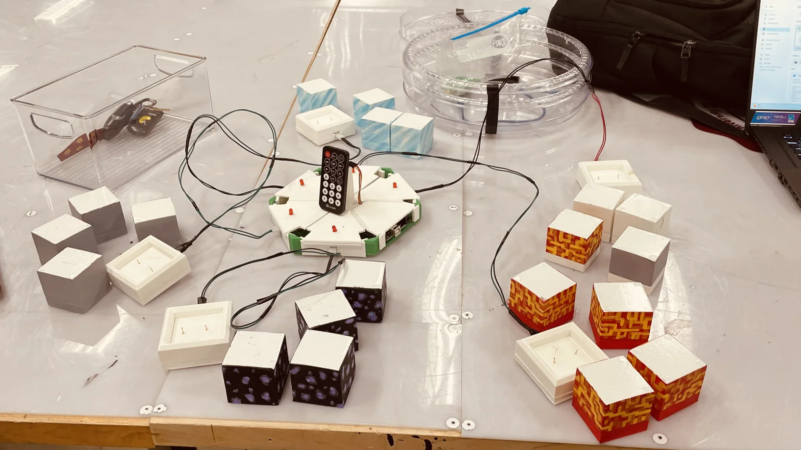 Tactile quiz system with four player docks and answer cubes
